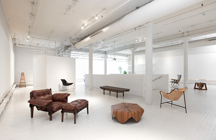 Modern Brazilian furniture shop featuring iconic design pieces in a clean, minimal showroom.