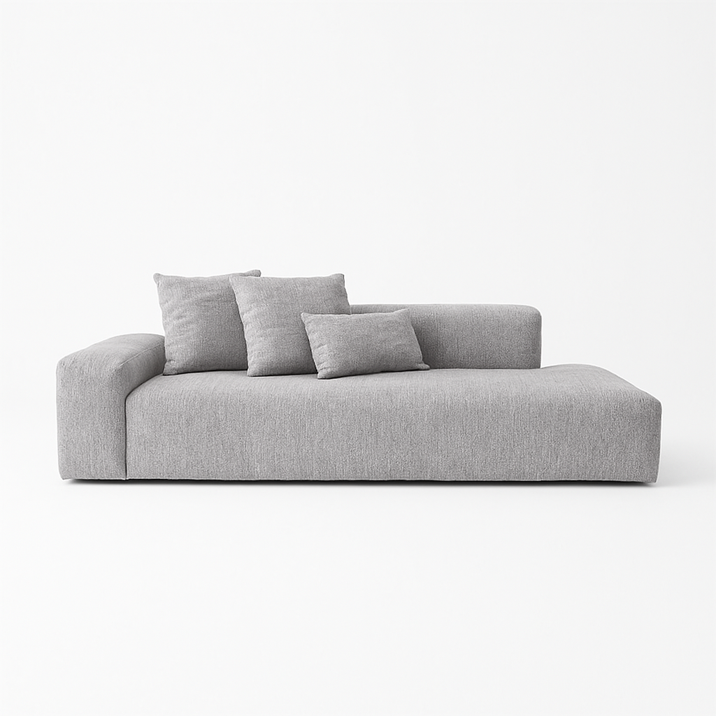 A contemporary modular sofa in light gray fabric, featuring minimalist lines, a single-armrest design, and three plush cushions. Made in Brazil, this piece exemplifies modern design and ergonomic comfort.