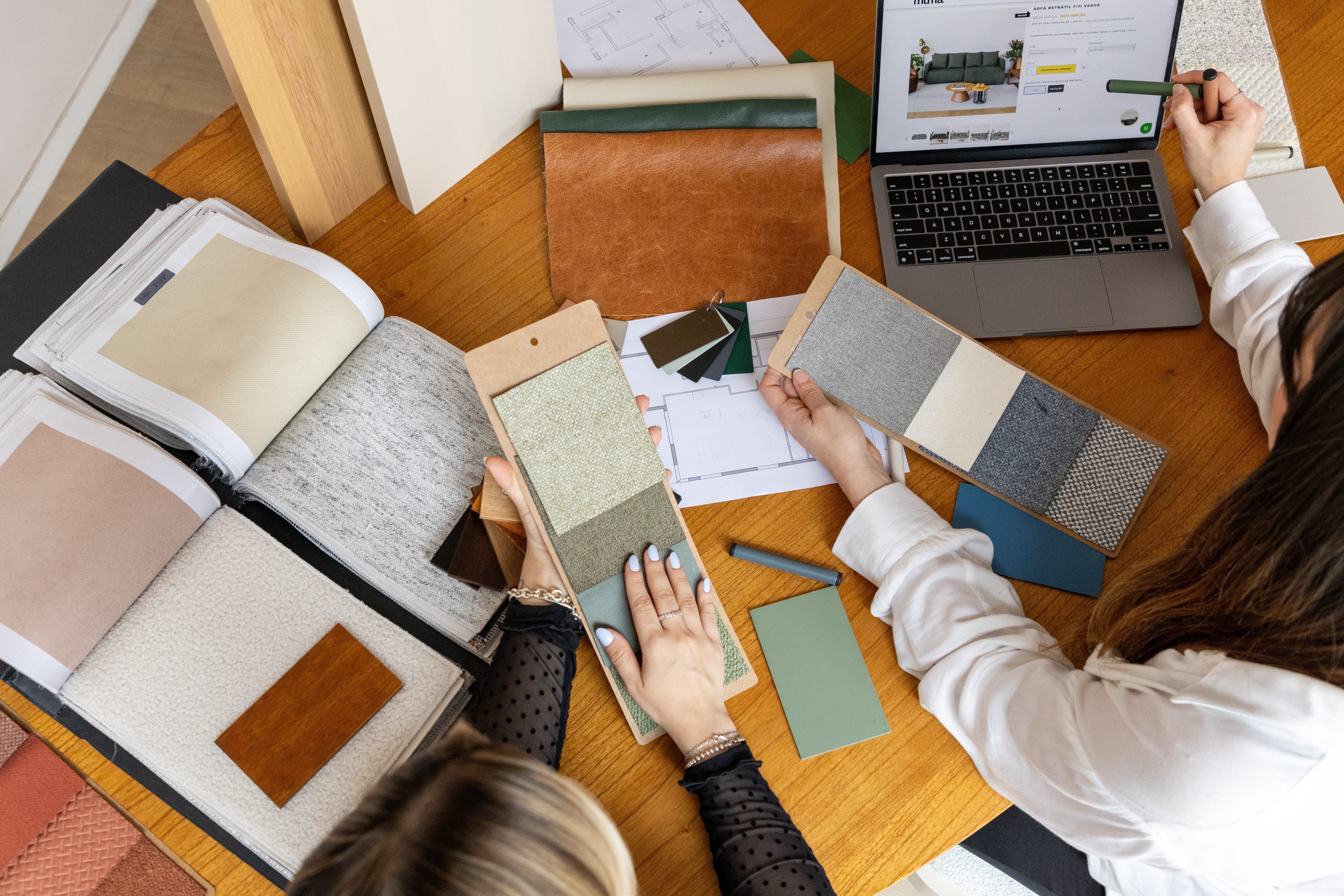 Vista Furniture team curating fabric and finish samples for export-ready furniture collections in Brazil