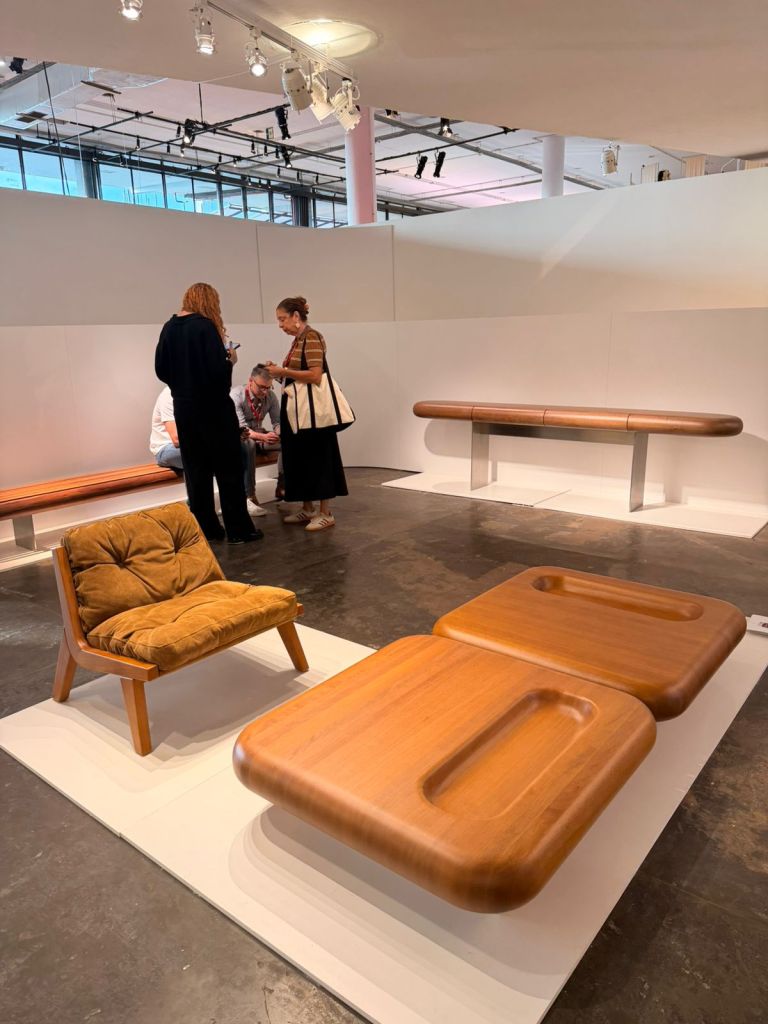 Visitors exploring Brazilian furniture design exhibition at SP-Arte São Paulo